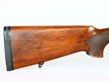 a close up of a rifle on a white background with a white background