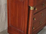 an image of a wooden chest of drawers in a room
