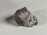a rock that is sitting on a white surface