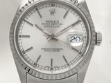 a silver rolex watch with roman numerals on it