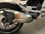 a close up of a motorcycle parked in a garage