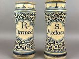pair of blue and white ceramic vases with the words r r hammond