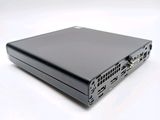 the back of a black laptop computer sitting on top of a white surface