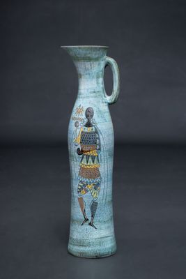 a blue vase with an image of a woman on it