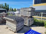 pallets stacked on top of each other in front of a building