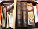 a box full of books sitting on a table