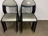 two chairs sitting next to each other in a room