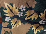 an image of a close up of a rug with a bird on it