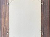 wooden picture frame with paper clips attached to it on a white background