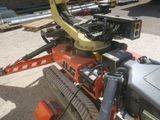 a robot that is sitting on top of a construction vehicle