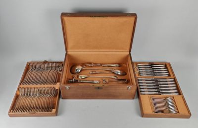 a wooden box with silverware in it on a table