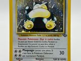 a close up of a pokemon card on a white surface
