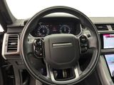 the interior of a car with a steering wheel and dashboard controls