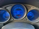 a close up of a car dashboard with various gauges