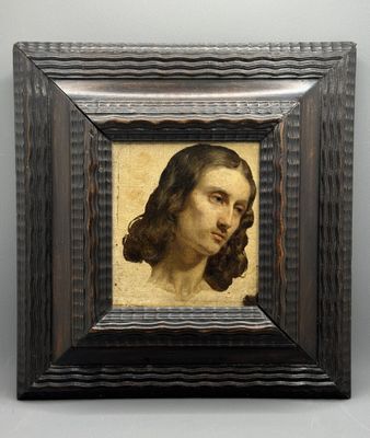 portrait d'un homme dans un cadre en bois sur fond blanc