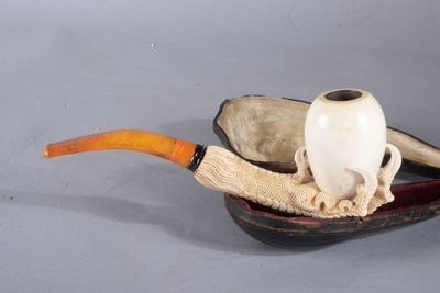 une image représentant une pipe et un crâne dans un bol