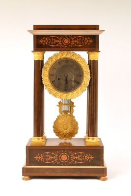 a clock that is sitting on top of a table