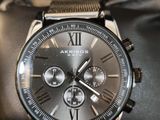 a close up of a watch on a wrist