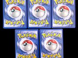 four plastic pokemon magnets with different designs on them on a black background
