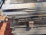 several pieces of metal are stacked on top of each other on a roof