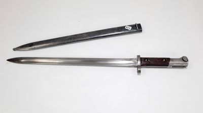 two knives are laying side by side on a white surface