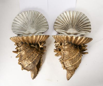 pair of brass shell sconces on a white background