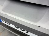 a close up of a car ' s bumper with a sticker on it