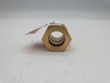 a nut that has a tag on it on a white surface