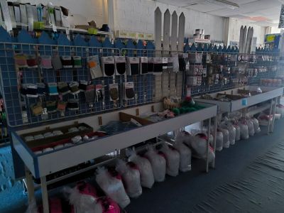 many bags of stuff on the shelves in the store