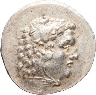 a silver coin with an image of a man ' s head on it