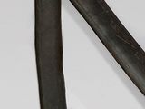 a black and gold sword with a black handle