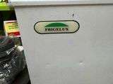a refrigerator with a sticker on it in a store