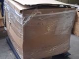 a large cardboard box on a pallet in a warehouse