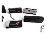 four different types of electronic devices on a white surface