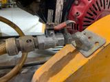 a close up of a machine with a hose attached to it