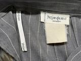 a close up of a suit with a label on it