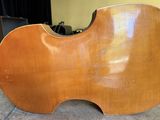 a close up of a violin with a wooden body on a table