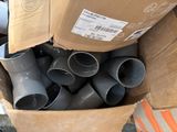 a cardboard box full of different types of pipes and fittings