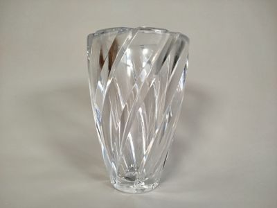 a glass vase that is sitting on a table