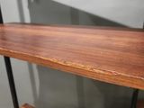 a close up of a wooden shelf with two shelves on it
