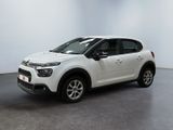 a white citrole is parked in a white room