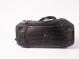 crocodile skin handbag on a white background with a white background