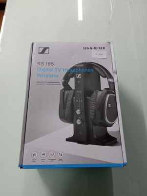 the box of a pair of headphones is sitting on a table