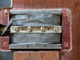 a close up of a metal latch on a wooden door
