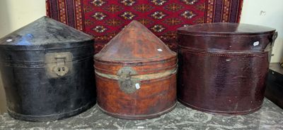 three old suitcases sitting next to each other on a rug