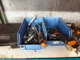 many tools in a blue box on a table