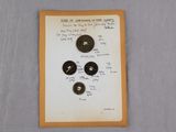 a piece of paper that has a bunch of buttons on it