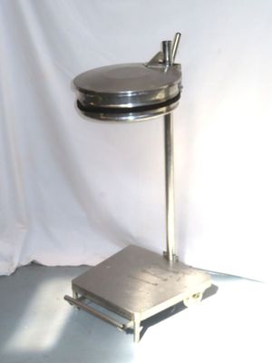 an image of a metal table with a lid on it
