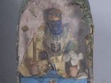 a small box with a picture of a man inside of it