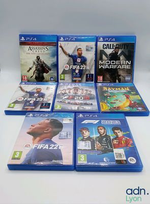 a bunch of video games sitting on top of a table